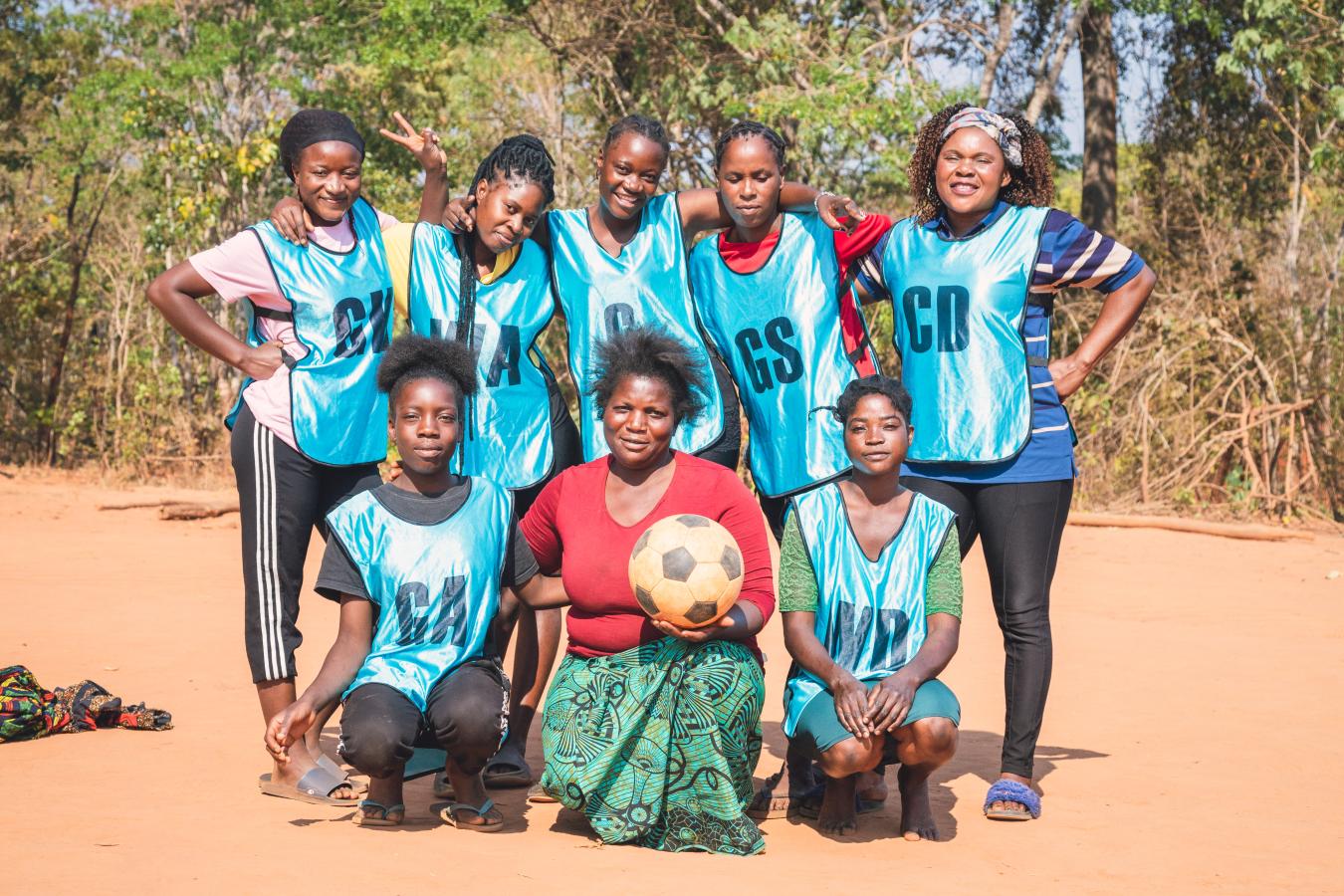 Members of the Tigwilizane women’s group in Mukungule, Zambia supporting one another during a community meeting. Photo by Mana Meadows.