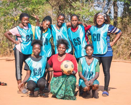 Members of the Tigwilizane women’s group in Mukungule, Zambia supporting one another during a community meeting. Photo by Mana Meadows.